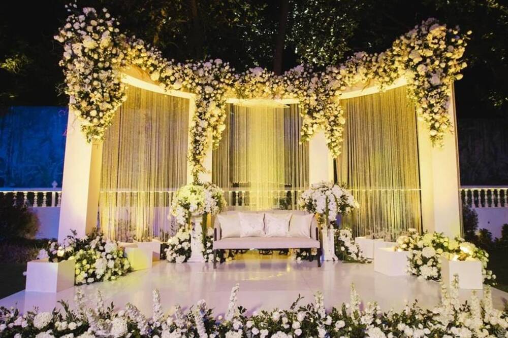 Golden Drapes with a Floral Canopy